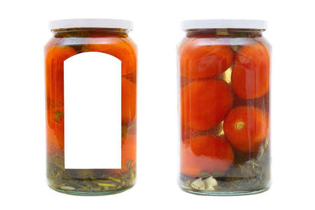 Glass jars with pickled plum tomatoes isolated on white backgroundの写真素材