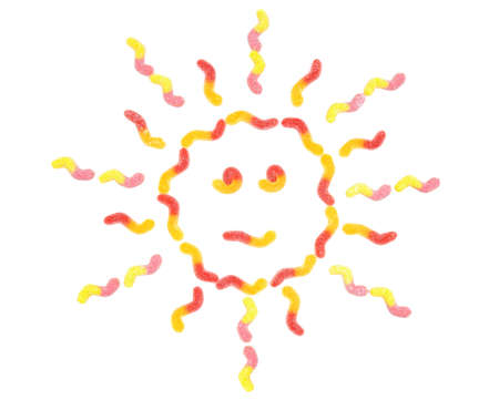 Sun shape made from gummy worm candies isolated on white backgroundの写真素材