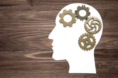 Male head profile outline with cogwheels and gears inside. Business strategy development concept.