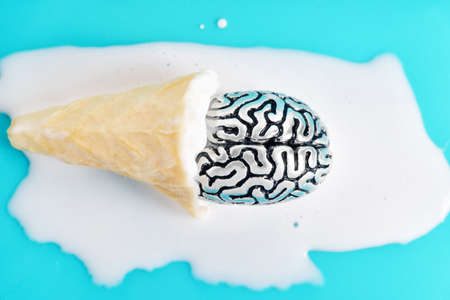 Human brain cooling down in a waffle cone ice cream. Extreme summer heatwave concept.