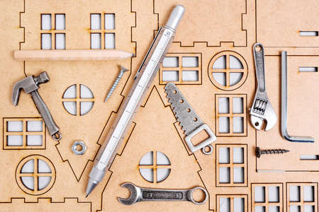 Miniature copies of essential hand tools on a house model frame. Getting ready for construction...