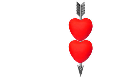Feathered bow arrow running through two red hearts isolated on white background.の写真素材