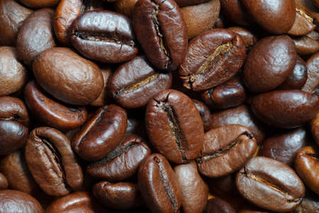 Roasted coffee beans closeup, abstract background.