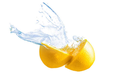 Two halves of a fresh lemon with water splashes isolated on white background.の写真素材