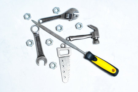 New year tree shape arranged from miniature copies of construction tools isolated on white.の写真素材