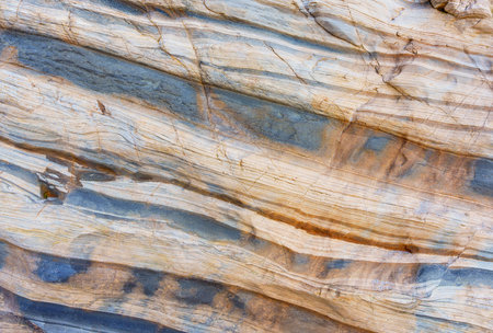 Malibu coast rock formations background. Elegant and eye-catching layered rocks pattern.