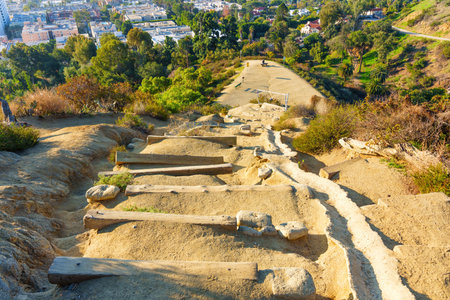 Wooden steps carved into the rocks lead to a vista point at Runyon Canyon Park in California,...
