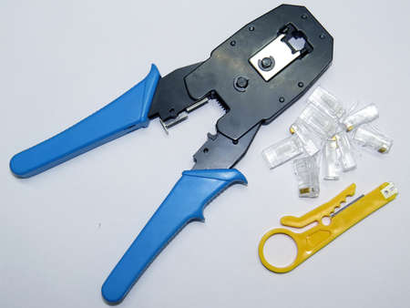  Network cable crimper tool and  jack  isolated on white background                               の写真素材