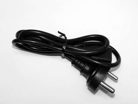  Power cable to the computer over white backgroundの写真素材