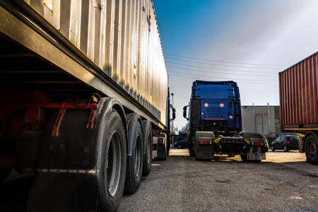 trucks parked in the parking area waiting to leaveの写真素材