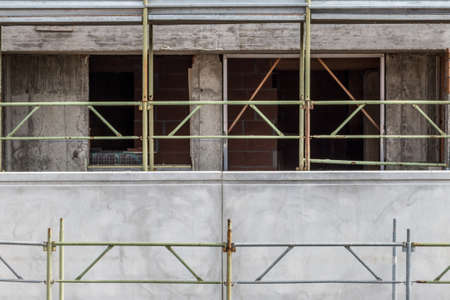 construction site with scaffolding mountedの写真素材