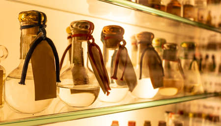 small bottles of grappa on the shelfの写真素材