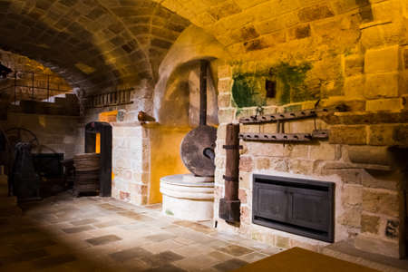 old stone crusher where olives were ground to produce oilの写真素材