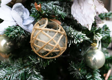 Christmas ball made with string and veil on fir
