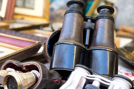 old binoculars exposed on the counter of an antique marketの写真素材