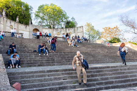 people sitting on the steps of staircaseのeditorial素材