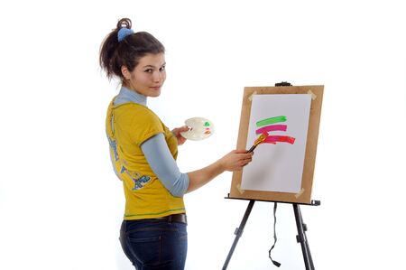 Artist paints a picture of turning look at camera isolated against backgroundの写真素材