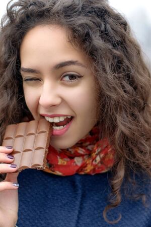 Portrait of a girl who did not get a piece of the chocolate barの写真素材