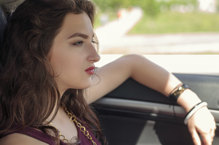 Woman is driving a car. Concept: transport, lifestyle, business