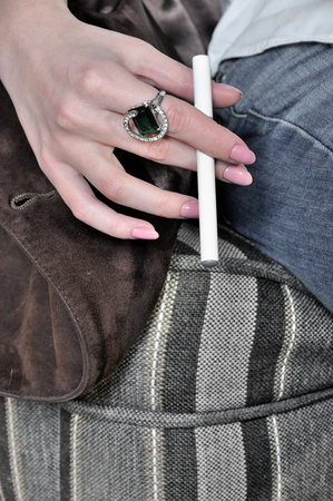 Closeup of electronic cigarette in the hand of the girlの写真素材