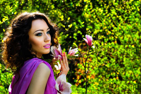 Beautiful Spring Girl with flowersの写真素材