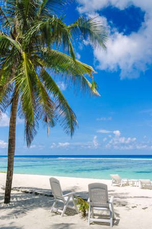 Two beach chairs on perfect tropical white sand beach in Maldivesの写真素材