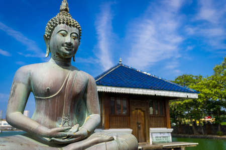 Buddha statue in Gangarama Buddhist Temple, Sri Lankaの写真素材