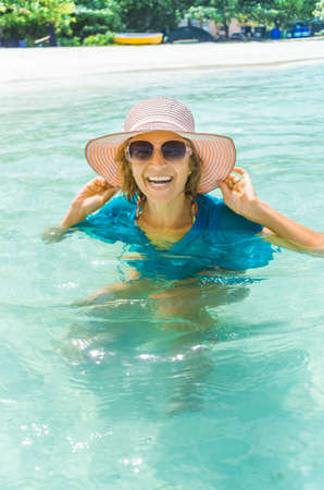Young beautiful woman relaxing on a Maldives beachの写真素材