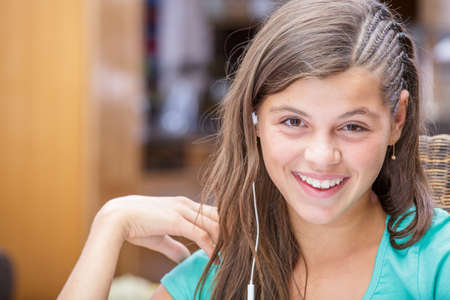 closeup of a pretty girl smiling with a headsetの写真素材