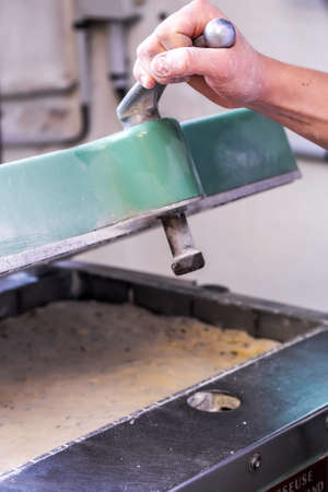closeup of an industrial machine prepare a dough breadの写真素材
