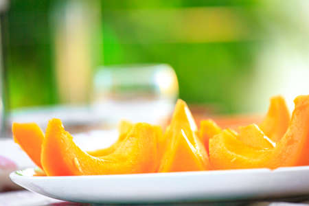 delicious Cantaloupe melon slices on the plate on tableの写真素材