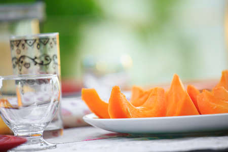 delicious Cantaloupe melon slices on the plate on tableの写真素材
