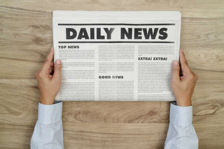 Businessman reading newspaperの写真素材