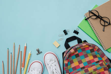 Top view school supplies on blue background with copy space.の写真素材