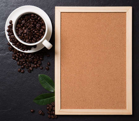 Top view mockup coffee beans in the cup with cork board.の写真素材