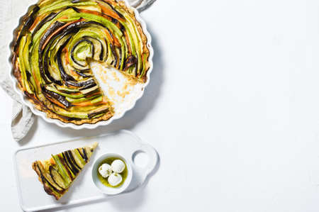 Traditional French Ratatouille tart. Top view, white background, space for text