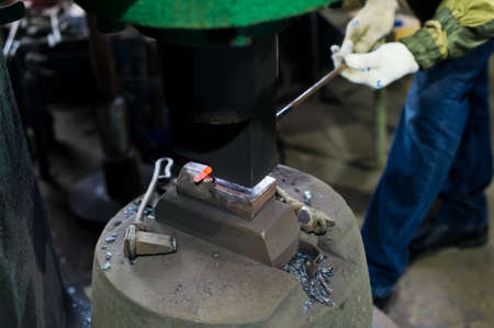 Blacksmith forges in hydraulic pressの写真素材