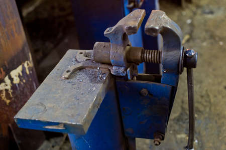 Workers vise blue blacksmith.の写真素材
