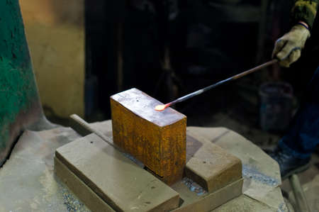 Blacksmith forges in hydraulic pressの写真素材