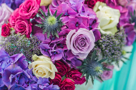 Table in the restaurant decorated with purple flowers, wedding dinner