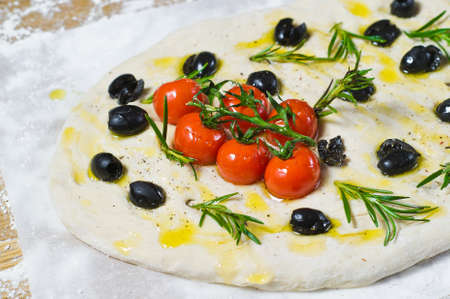 raw Focaccia. Top view, wooden backgroundの写真素材