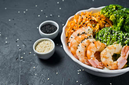 Buddha bowl. Healthy balanced food. Black background, top view, space for textの写真素材