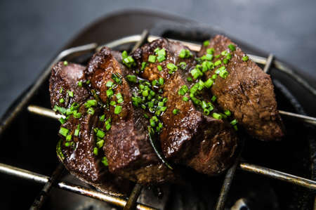 beef tenderloin grilled steak, black background, top view