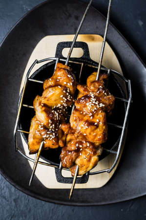 grilled chicken kebab, black background, top viewの写真素材