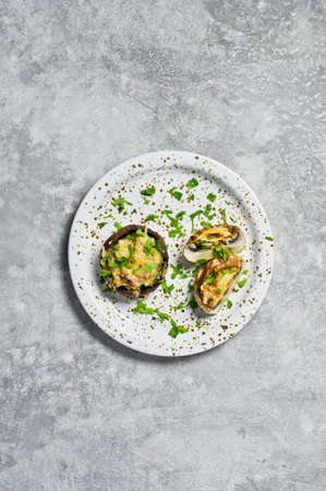 Baked stuffed mushrooms. Gray background, top view, space for textの写真素材