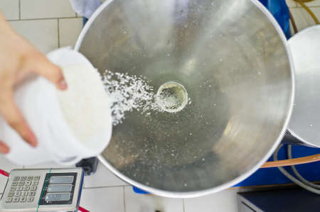 work sleeps coconut chips in an industrial crusher - press. Food production