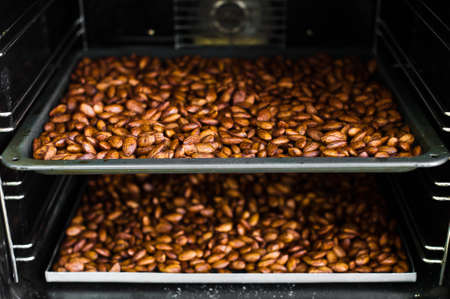 Baking almonds in an industrial oven