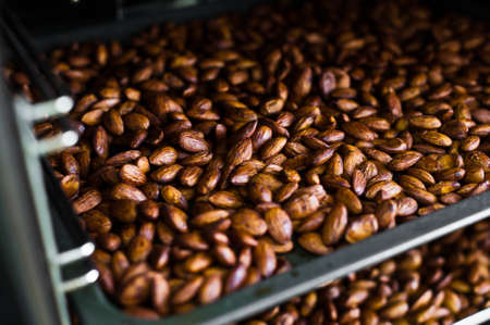 Baking almonds in an industrial oven