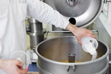 worker falls asleep aspiration in industrial mixer, food industry, conveyor lineの写真素材