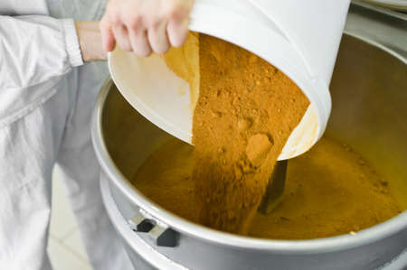 worker falls asleep aspiration in industrial mixer, food industry, conveyor line